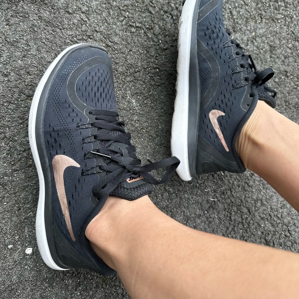 Nike Flex 2017 Run, black with rose gold accents. Size 6 used.